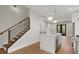 Open concept kitchen and staircase with hardwood floors at 2329 Mason Dr # D24, Atlanta, GA 30316