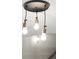 Three-light pendant fixture with exposed bulbs and brass accents at 2329 Mason Dr # D24, Atlanta, GA 30316