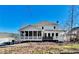 Two-story house with a large deck, screened porch and mature trees at 31 River Walk Pkwy, Euharlee, GA 30145