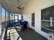 Cozy screened porch with seating area and ceiling fan at 31 River Walk Pkwy, Euharlee, GA 30145