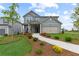 Two-story house with gray siding, landscaping, and a two-car garage at 3340 Redwood Ct, Covington, GA 30016