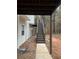 Stairs leading up to a deck overlooking a wooded backyard at 360 Chestnut Dr, Covington, GA 30016