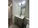 Modern bathroom with vanity, toilet, and mirror at 360 Chestnut Dr, Covington, GA 30016