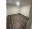Simple bedroom with hardwood flooring at 360 Chestnut Dr, Covington, GA 30016