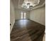 Spacious bedroom with wood-look floors and French doors leading to a deck at 360 Chestnut Dr, Covington, GA 30016