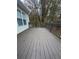 Spacious back deck with wooden railings, overlooking a wooded area at 360 Chestnut Dr, Covington, GA 30016