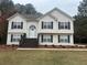 Two story house with brown accents and landscaping at 360 Chestnut Dr, Covington, GA 30016