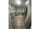 Open concept kitchen with stainless steel appliances and gray cabinets at 360 Chestnut Dr, Covington, GA 30016