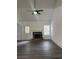 Living room with fireplace and laminate flooring at 360 Chestnut Dr, Covington, GA 30016