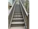 Exterior wooden stairs leading to deck at 360 Chestnut Dr, Covington, GA 30016
