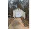 White storage shed with a concrete pathway at 360 Chestnut Dr, Covington, GA 30016