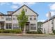 Beautiful 3 story townhome with light gray siding and landscaping at 3684 Allegretto Cir, Atlanta, GA 30339