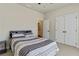 Bedroom with carpeted floors and double doors to a closet at 391 Mulberry Rock Rd, Temple, GA 30179