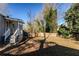 Grass backyard with wooden fence and trees at 2452 Semmes St, Atlanta, GA 30344