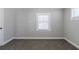 Simple bedroom with neutral walls, carpet, and one window at 2452 Semmes St, Atlanta, GA 30344