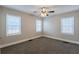 Spacious bedroom with neutral walls, carpeting, and ceiling fan at 2452 Semmes St, Atlanta, GA 30344