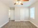 Bedroom with neutral walls, carpeting, ceiling fan, and closet at 2452 Semmes St, Atlanta, GA 30344