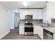 Renovated kitchen with granite countertops and stainless steel appliances at 2452 Semmes St, Atlanta, GA 30344