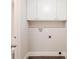 Laundry area with white cabinets and vinyl flooring at 2452 Semmes St, Atlanta, GA 30344