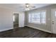 Living room features dark gray vinyl flooring and ceiling fan at 2452 Semmes St, Atlanta, GA 30344