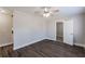 Bright living room with dark gray vinyl flooring and ceiling fan at 2452 Semmes St, Atlanta, GA 30344
