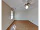 Spacious bedroom with hardwood floors and large window at 5151 Brockinton Sw Ct, Lilburn, GA 30047