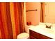 Bathroom with shower/tub combo and dark wood vanity at 8178 Lochley Dr, Fairburn, GA 30213