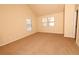 Bright bedroom featuring a vaulted ceiling and carpet flooring at 8178 Lochley Dr, Fairburn, GA 30213