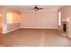 Living room with neutral carpeting and fireplace at 8178 Lochley Dr, Fairburn, GA 30213