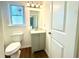 Small bathroom with toilet and vanity at 3945 Peninsula Ct, Lawrenceville, GA 30044