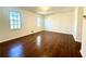 Spacious bedroom with hardwood floors and two windows at 3945 Peninsula Ct, Lawrenceville, GA 30044