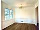 Bright dining room with hardwood floors and chandelier at 3945 Peninsula Ct, Lawrenceville, GA 30044