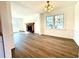 Bright dining room with hardwood floors and chandelier at 3945 Peninsula Ct, Lawrenceville, GA 30044
