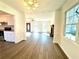 Open concept dining room with hardwood floors and kitchen view at 3945 Peninsula Ct, Lawrenceville, GA 30044