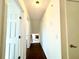 Bright hallway with hardwood floors and access to upper level at 3945 Peninsula Ct, Lawrenceville, GA 30044