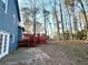 View of house exterior, deck and backyard at 3945 Peninsula Ct, Lawrenceville, GA 30044