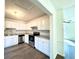 Modern kitchen with white cabinets and granite countertops at 3945 Peninsula Ct, Lawrenceville, GA 30044
