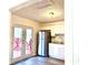 Kitchen with stainless steel appliances and deck access at 3945 Peninsula Ct, Lawrenceville, GA 30044
