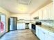 Modern kitchen with stainless steel appliances and deck access at 3945 Peninsula Ct, Lawrenceville, GA 30044