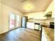 Updated kitchen with white cabinets and granite countertops at 3945 Peninsula Ct, Lawrenceville, GA 30044