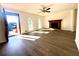 Spacious living room with hardwood floors and brick fireplace at 3945 Peninsula Ct, Lawrenceville, GA 30044