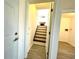 Stairs to upper level with fireplace view at 3945 Peninsula Ct, Lawrenceville, GA 30044
