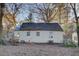 Back of house with a small deck and yard at 1743 Marcel Sw Ave, Atlanta, GA 30311