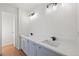 Bathroom with double vanity and updated light fixtures at 3039 Sable Run Rd, Atlanta, GA 30349