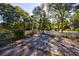 Partially paved backyard with a white fence at 1490 Lee Peters Rd, Loganville, GA 30052