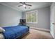 Bright bedroom with a comfortable bed, workspace, and ample natural light at 1337 Benteen Park Se Dr, Atlanta, GA 30315