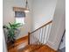 Elegant wooden staircase with a large plant at 1337 Benteen Park Se Dr, Atlanta, GA 30315