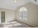 Well-lit bedroom featuring an arched window at 6315 Sturbridge Ln, Cumming, GA 30040