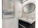 Modern powder room with floating vanity and sleek oval mirror at 1099 North Ne Ave # 13, Atlanta, GA 30307