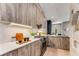 Modern kitchen with wood cabinets, quartz countertops, and stainless steel appliances at 1099 North Ne Ave # 13, Atlanta, GA 30307